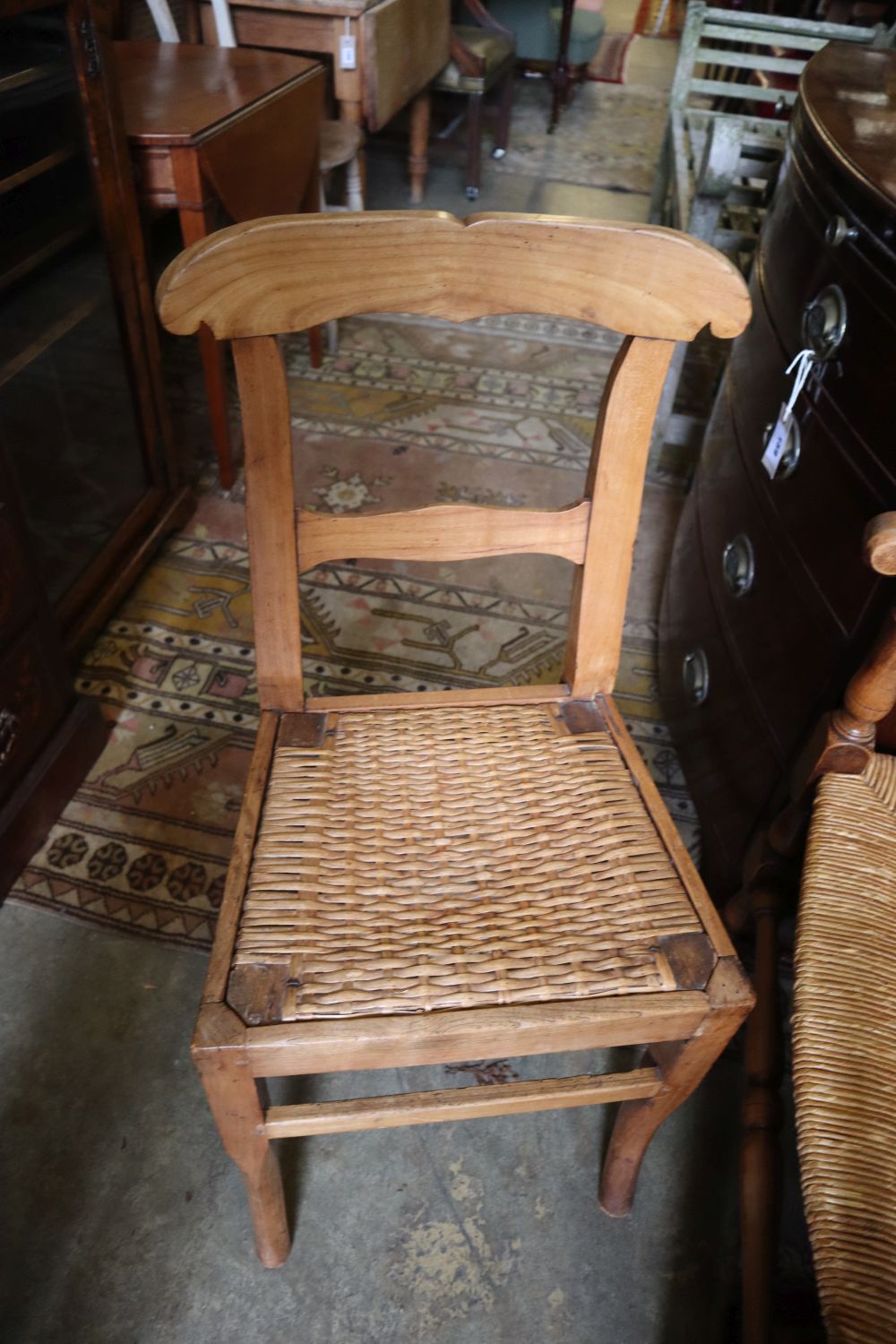 A pair of beech rush seat elbow chairs and a pair of 19th century French fruitwood chairs